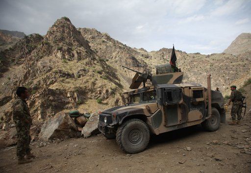 (150517) -- KABUL, May 17, 2015 (Xinhua) -- Afghan army soldiers stand guard at a checkpoint on the outskirt of Kabul, Afghanistan, May 16, 2015. A total of 151 Taliban militants have been killed during military operations and clashes with the ...