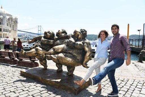 (150723) -- ISTANBUL, July 23, 2015 (Xinhua) -- Tourists pose with sculptures by Chinese contemporary sculptor Xu Hongfei in Istanbul, Turkey, on July 23, 2015. Chinese contemporary sculptor Xu Hongfei\