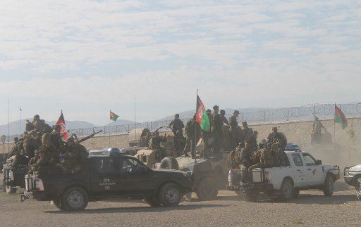 (150805) -- FARYAB, Aug. 5, 2015 (Xinhua) -- Afghan soldiers gather around their vehicles at a military camp in Faryab Province, north Afghanistan, Aug. 5, 2015. Units of Afghan national police backed by the army have killed 88 Taliban militants ...