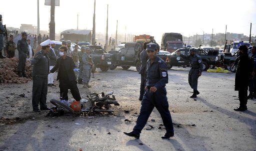 (150712) -- KABUL, July 12, 2015 (Xinhua) -- Afghan security personnel inspect the site of a suicide attack in Kabul, Afghanistan, July 11, 2015. Two suicide bombers died while one bystander child wounded in an explosion in Kabul on Saturday, police ...