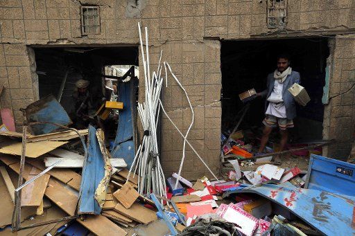(150720) -- SANAA, July 20, 2015 (Xinhua) -- A man clears up his shop destroyed in airstrikes carried out by the Saudi-led coalition in Sanaa, Yemen, July 20, 2015. At least three civilians were killed and 12 others injured in the airstrike ...
