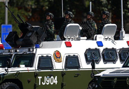 (150903) -- BEIJING, Sept. 3, 2015 (Xinhua) -- Armed police force anti-terrorist assault vehicles attend a military parade in Beijing, capital of China, Sept. 3, 2015. China on Thursday held commemoration activities, including a grand military ...