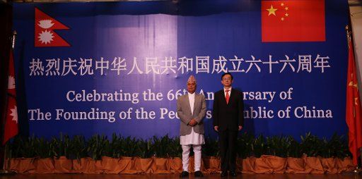(150929) -- KATHMANDU, Sept. 29, 2015 (Xinhua) -- Nepalese Vice President Paramananda Jha (L) and Chinese Ambassador to Nepal Wu Chuntai attend a reception celebrating the 66th anniversary of the founding of the People\