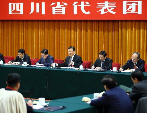 (160307) -- BEIJING, March 7, 2016 (Xinhua) -- Liu Yunshan (C, back), a member of the Standing Committee of the Political Bureau of the Communist Party of China Central Committee, joins a group deliberation of deputies from Sichuan Province to the ...