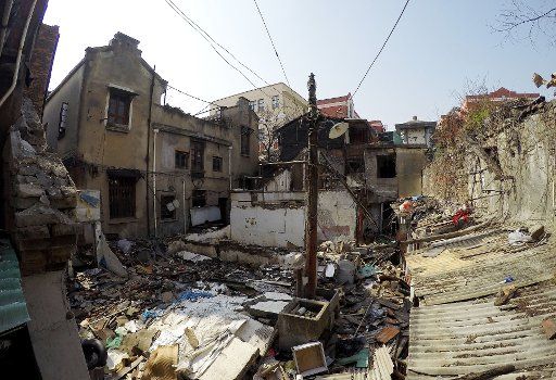 (160225) -- SHANGHAI, Feb. 25, 2016 (Xinhua) -- Photo taken on Feb. 25, 2016 shows houses having been demolished around a building used by the Japanese army as a military brothel during World War II, in Shanghai, east China. The Shanghai government ...