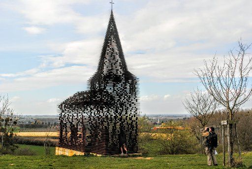 (160404) -- BORGLOON, April 4, 2016 (Xinhua) -- Photo taken on April 3, 2016 shows a "see-through church", a site specific work entitled "Reading between the lines" outside Belgian town of Borgloon. Completed in 2011 by the Belgian architects duo ...