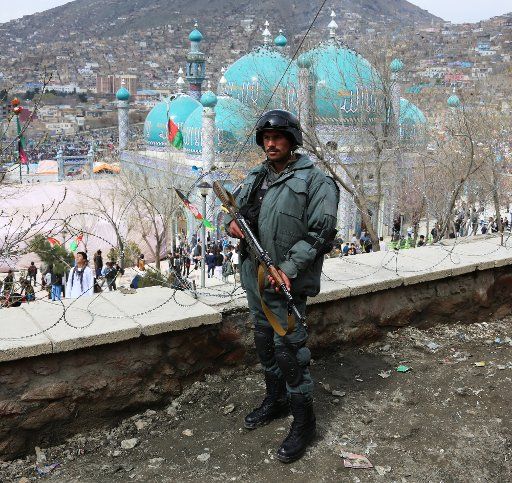 (160320) -- KABUL, March 20, 2016 (Xinhua) -- An Afghan policeman stands guard at the site of the Afghan New Year celebration in Kabul, capital of Afghanistan, March 20, 2016. Afghans celebrated Nawroz or New Year amid tight security on Sunday. (...