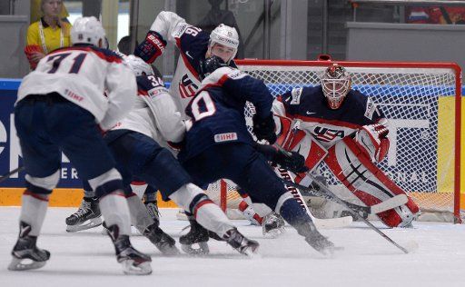 (160518) -- ST. PETERSBURG, May 18, 2016 (Xinhua) -- Keith Kinkaid (1st R), goalie of the United States, defends during Group B preliminary round game between the United States and Slovakia of 2016 IIHF Ice Hockey World Championship in St. ...