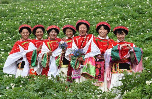 (160709) -- XUNDIAN, July 9, 2016 (Xinhua) -- Girls of the Yi ethnic group pose for a group photo at Xilalong Village in Liushao Township of Xundian Hui and Yi Autonomous County, southwest China\