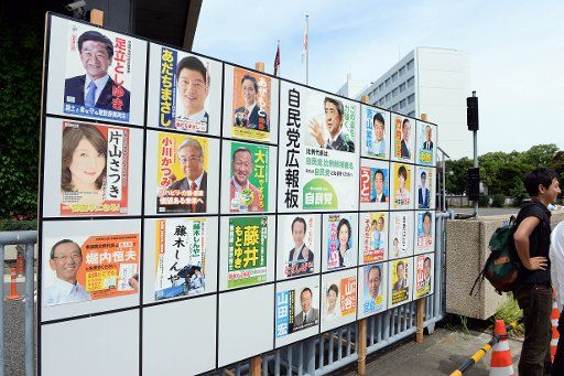 (160710) -- TOKYO, July 10, 2016 (Xinhua) -- A board displaying candidates of Japanese upper house election is seen outside the headquarters of Liberal Democratic Party (LDP) in Tokyo, capital of Japan, on July 10, 2016. Voting for the Japanese ...