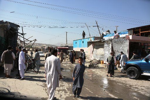 (160620) -- KABUL, June 20, 2016 (Xinhua) -- People gather at the site of a suicide attack in Kabul, capital of Afghanistan, June 20, 2016. Fourteen Nepalese citizens were killed and nine people were injured after a suicide bomber struck a minibus ...