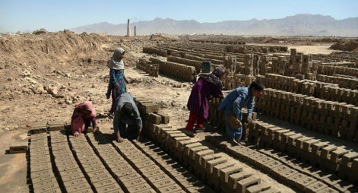 (160721) -- KABUL, July 21, 2016 (Xinhua) -- Afghan children work at a brick factory in Kabul, capital of Afghanistan, July 21, 2016. Some 1.3 million school-aged Afghan children are deprived from education while thousands of children have been ...