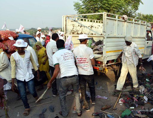 (161015) -- VARANASI, Oct. 15, 2016 (Xinhua) -- People clean the site after a stampede accident in Varanasi, Uttar Pradesh, India, Oct. 15, 2016. At least 24 people were killed and dozens injured Saturday during stampede at a religious gathering in ...