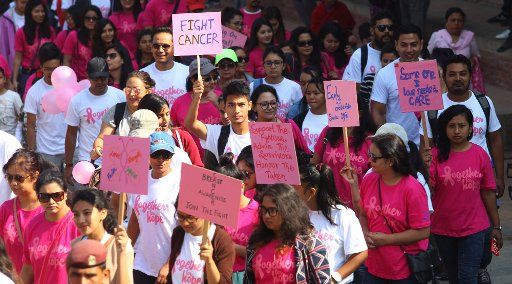(161022) -- LALITPUR, Oct. 22, 2016 (Xinhua) -- People participate in a walkathon titled "Together for Hope" organized as part of a Breast Cancer Awareness campaign at Mangalbazar in Lalitpur, Nepal, Oct. 22, 2016. October is Breast Cancer Awareness ...