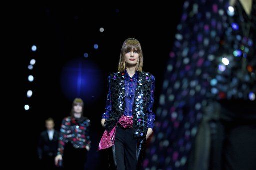 (170225) -- MILAN, Feb. 25, 2017 (Xinhua) -- A model presents a creation for fashion house Emporio Armani during Milan Fashion Week Fall\/Winter 2017\/2018 on Feb. 24, 2017, in Milan, Italy. (Xinhua\/Jin Yu) (yk)