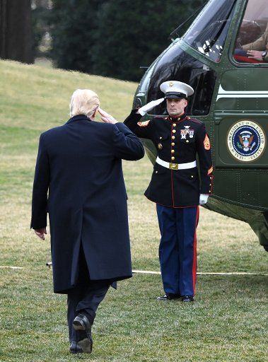 (170204) -- WASHINGTON, Feb. 4, 2017 (Xinhua) -- U.S. President Donald Trump salutes as he boards Marine One departing for Andrews Air Force Base en route to West Palm Beach, Florida, at White House in Washington D.C.,the United States, Feb. 3, 2017....
