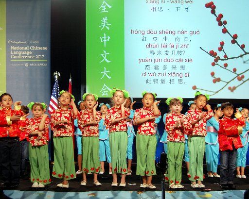 (170407) -- HOUSTON, April 7, 2017 (Xinhua) -- Students from Houston Independent School District read a poem of Tang Dynasty during the opening ceremony of the 10th National Chinese Language Conference of the United States in Houston, Texas, the ...
