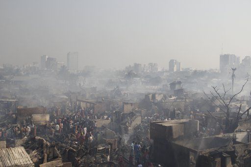 (170316) -- DHAKA, March 16, 2017 (Xinhua) -- Photo taken on March 16, 2017 shows the slum after a devastating fire in Dhaka, capital of Bangladesh. A devastating fire swept through one of the largest slums in Bangladesh capital Dhaka early Thursday,...