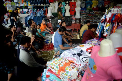 (170602) -- JAKARTA, June 2, 2017 (Xinhua) -- Indonesian Muslims attend the first Friday noon prayer during the holy month of Ramadan at a textile and cloth market in Jakarta, Indonesia, June 2, 2017. (Xinhua\/Agung Kuncahya B.) (zcc)