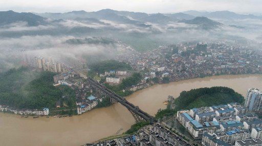 (170630) -- SANJIANG, June 30, 2017 (Xinhua) -- The fog cloaks Sanjiang Dong Autonomous County in Liuzhou, south China\