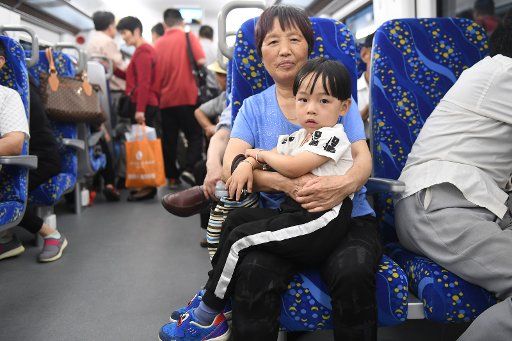 (170615) -- NINGBO, JUNE 15, 2017 (Xinhua) -- Passengers take a CRH6F train on a line linking the cities of Ningbo and Yuyao, east China\