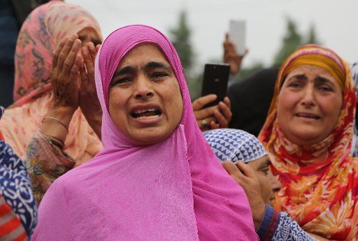 (170712) -- SRINAGAR, July 12, 2017 (Xinhua) -- Kashmiri women wail over the killing of a militant belonging to Hizbul Mujahideen (HM) during his funeral procession in Srinagar, summer capital of Indian-controlled Kashmir, July 12, 2017. Three ...