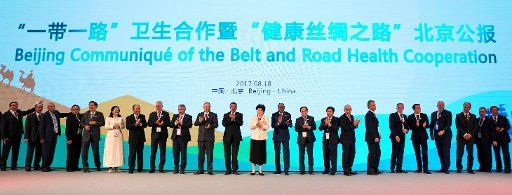 (170818) -- BEIJING, Aug. 18, 2017 (Xinhua) -- Delegates pose for photo as they issue the Beijing Communique of the Belt and Road Health Cooperation at the "Belt and Road High-level Meeting for Health Cooperation: towards a Health Silk Road" in ...