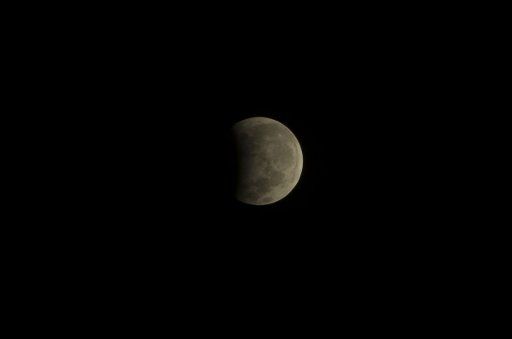 (170807) -- JAKARTA, Aug. 7, 2017 (Xinhua) -- Photo taken on Aug. 7, 2017 shows the partial lunar eclipse over Jakarta, Indonesia. (Xinhua\/Zulkarnain)