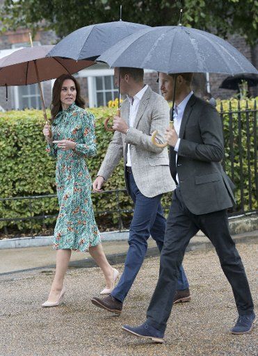 (170830) -- LONDON, Aug. 30, 2017 (Xinhua) -- Prince William (C), the Duke of Cambridge, and his wife Catherine, the Duchess of Cambridge and Prince Harry arrive at the White Garden in the grounds of Kensington Palace in London, Britain on Aug. 30, ...