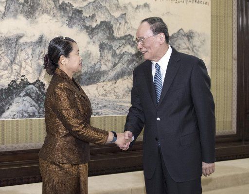 (170926) -- BEIJING, Sept. 26, 2017 (Xinhua) -- Wang Qishan, secretary of the Communist Party of China (CPC) Central Commission for Discipline Inspection, meets with Cambodian Deputy Prime Minister Men Sam An in Beijing, capital of China, Sept. 26, ...