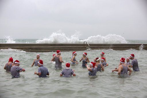 (180101) -- OPATIJA (CROATIA), Jan. 1, 2018 (Xinhua) -- Participants stand in water during the New Year Swimming in Opatija, Croatia, Jan. 1, 2018. (Xinhua\/Nel Pavletic) (zjy)