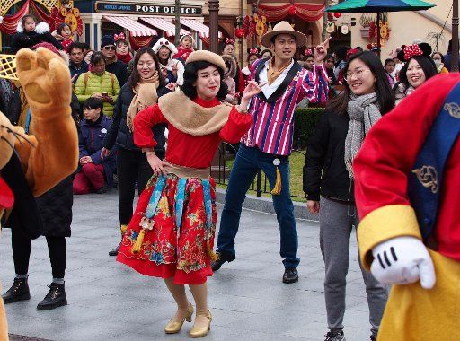 (180124) -- SHANGHAI, Jan. 24, 2018 (Xinhua) -- Actors dressed in Disney cartoon character outfits perform old Shanghai swing dance at Shanghai Disney Resort to welcome Chinese Lunar New Year which falls on Feb. 16 this year in Shanghai, east China, Jan. 24, 2018. (Xinhua\/Ren Long)(wsw)
