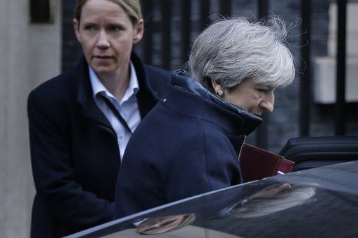 (180117) -- LONDON, Jan. 17, 2018 (Xinhua) -- British Prime Minister Theresa May (front) leaves 10 Downing Street for Prime Minster\