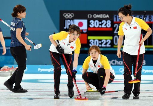 (180217) -- PYEONGCHANG, Feb. 17, 2018 (Xinhua) -- Ma Jingyi (3rd R), Liu Jinli (2nd R) and Zhou Yan of China compete during the women round robin event of curling against Japan at 2018 PyeongChang Winter Olympic Games at Gangneung Curling Centre, Gangneung, South Korea, Feb. 17, 2018. China won 7-6. (Xinhua\/Ma Ping)