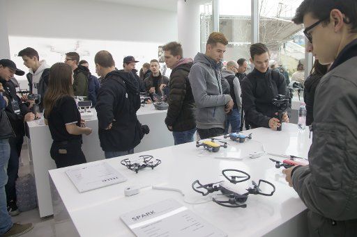 (180407) -- BUDAPEST, April 7, 2018 (Xinhua) -- Customers are seen in the first authorized retail shop of Chinese drone manufacturer DJI on its opening day in Budapest, Hungary, on April 7, 2018. (Xinhua\/Attila Volgyi)