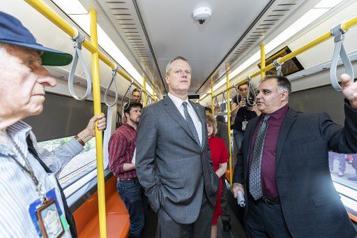 (180516) -- BOSTON, May 16, 2018 (Xinhua) -- Massachusetts Governor Charlie Baker (C) takes a ride on a new Orange Line train manufactured by China Railway Rolling Stock Corporation (CRRC) at Wellington Yard in Medford, a residential and industrial suburb of Boston, the United States, on May 15, 2018. New subway cars designed and manufactured by CRRC are undergoing tests and will be ready to take passengers in Boston by the end of 2018, said local officials on Tuesday. (Xinhua\/Li Muzi)(yy)