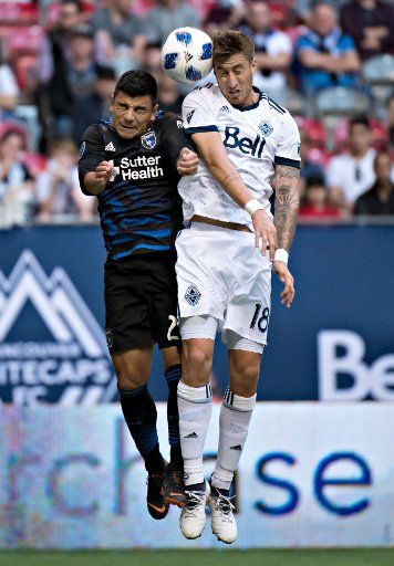 (180517) -- VANCOUVER, May 17, 2018(Xinhua) -- Nick Lima (L) of the San Jose Earthquakes and Jose Aja of Vancouver Whitecaps compete for the ball during the regular season of MLS match at BC Place in Vancouver, Canada, May 16, 2018. (Xinhua\/Andrew Soong)