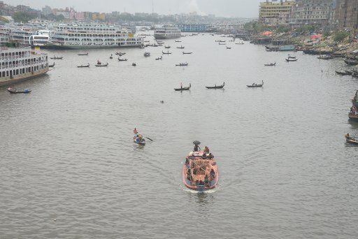 (180522) -- DHAKA, May 22, 2018 (Xinhua) -- Vessels are seen on Buriganga river in Dhaka, Bangladesh on May 22, 2018. Water transportation is still an important means of communication in Bangladesh where traditional country boats and small vessels are still in use to provide cheap and convenient transport. (Xinhua) (lrz)