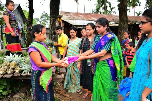 (180613) -- TRIPURA, June 13, 2018 (Xinhua) -- Health workers give free sanitary pads to the tribal women and girls on the outskirts of Agartala, capital of the northeastern state of Tripura, India, June 13, 2018. (Xinhua\/Stringer)(jmmn)