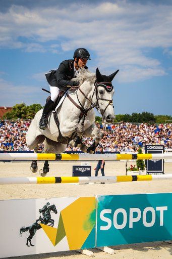(180618) -- SOPOT, June 18, 2018 (Xinhua) -- A rider competes during the eighth leg of 2018 Longines FEI Jumping Nations Cup in Sopot, northern Poland on June 17, 2018. (Xinhua\/Chen Xu)