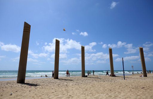 (180618) -- HAIFA (ISRAEL), June 18, 2018 (Xinhua) -- People enjoy their time on the Mediterranean Sea beach in Haifa, Israel, on June 17, 2018. (Xinhua\/Ayman Nobani)