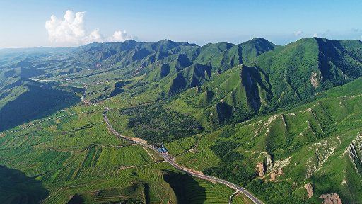 (180718) --GUYUAN, July 18, 2018 (Xinhua) -- Aerial photo taken on July 17, 2018 shows the Liupanshan Mountain in Longde County of Guyuan City, northwest China\