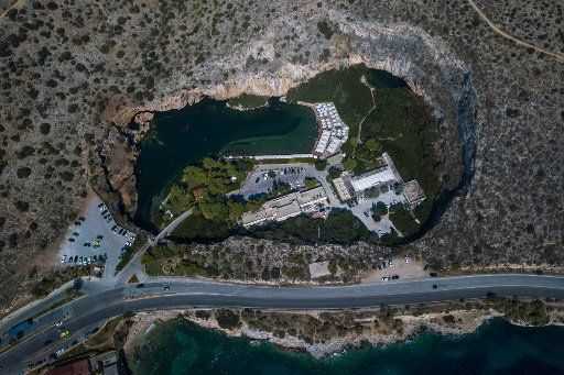 (180720) -- ATHENS, July 20, 2018 (Xinhua) -- Photo taken on July 19, 2018 with drone shows a general view of Vouliagmeni Lake in south region of Athens, Greece. Situated on an idyllic landscape, the rare geological phenomenon of the Vouliagmeni Lake attracts many visitors. (Xinhua \/Lefteris Partsalis)
