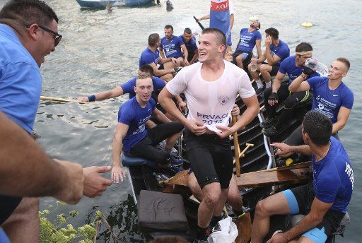(180812) -- METKOVIC, Aug. 12, 2018 (Xinhua) -- Competitors take part in the 21th "Maraton Ladja", an amateur race of indigenous Neretva boats (ladja) in Metkovic, Croatia, on Aug. 11, 2018. (Xinhua\/Ivo Cagalj)
