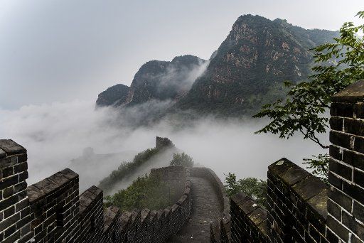 (180814) -- TIANJIN, Aug. 14, 2018 (Xinhua) -- Photo taken on Aug. 13, 2018 shows cloud and fog after a rainfall at Huangyaguan section of the Great Wall in the Jizhou District of Tianjin, north China. (Xinhua\/Wang Guangshan)