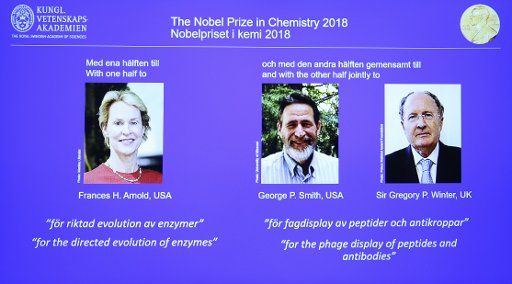 (181003) -- STOCKHOLM, Oct. 3, 2018 (Xinhua) -- Photo taken on Oct. 3, 2018 shows a screen displaying the portraits of awarded scientists Frances H. Arnold of the United States (L), George P. Smith of the United States (C) and Sir Gregory P. Winter of the UK (R) for the 2018 Nobel Prize in Chemistry during a press conference at the Royal Swedish Academy of Sciences in Stockholm, Sweden. The 2018 Nobel Prize in Chemistry is awarded to three scientists, the Royal Swedish Academy of Sciences announced on Wednesday. (Xinhua\/Ye Pingfan)(dh)