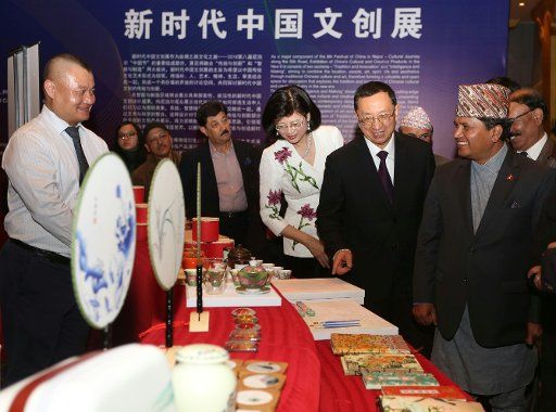 (181113) -- KATHMANDU, Nov. 13, 2018 (Xinhua) -- Nepali Minister for Culture, Tourism and Civil Aviation Rabindra Adhikari (1st R, Front) and visiting Chinese Minister of Culture and Tourism Luo Shugang (2nd R, front) visit an exhibition of China\