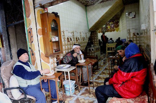 (181205) -- MOSUL (IRAQ), Dec. 5, 2018 (Xinhua) -- People gather in a small coffee shop in the old city of Mosul, Iraq, on Dec. 5, 2018. About 17 months after liberation from the extremist Islamic State (IS) militant group, Iraq\