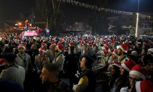 (181222) -- DAMASCUS, Dec. 22, 2018 (Xinhua) -- Syrians take part in a Christmas celebration in Damascus, capital of Syria, on Dec. 22, 2018. This year is the first in seven years for Damascus to celebrate the holiday season with all its surroundings empty of rebels. (Xinhua\/Ammar Safarjalani)