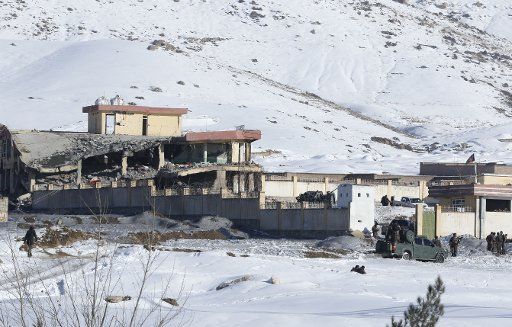 (190121) -- MAIDAN SHAR (AFGHANISTAN), Jan. 21, 2019 (Xinhua) -- Afghan security force members inspect the site of a Taliban attack in Maidan Shar, capital of Wardak province, Afghanistan, Jan. 21, 2019. At least 18 people were killed and 27 others wounded after a Taliban car bomb explosion hit an Afghan Special Forces\